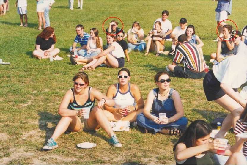 Group of students sitting on the grass.