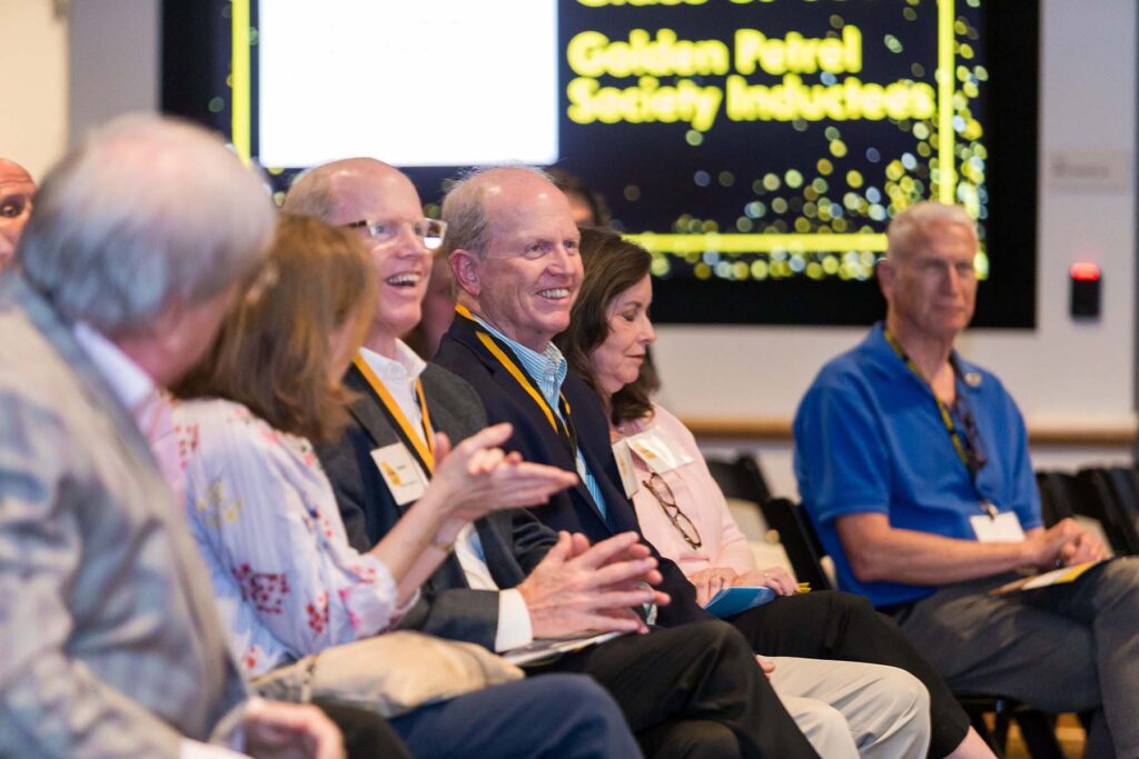 Members of the Golden Petrel society seated at awards ceremony.