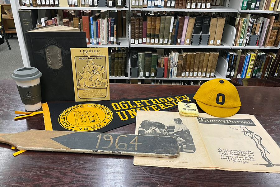 Library archives, including a yearbook, pennant and newspaper.